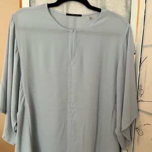 Elie Tahari light blue top.